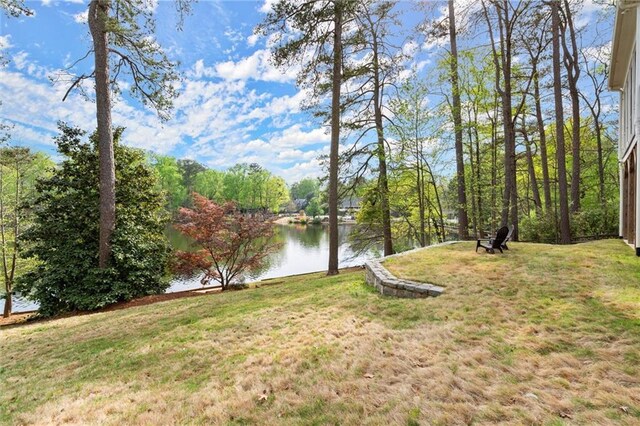 1141 Ragley Hall Rd NE, Brookhaven, GA 30319 - view of grassy yard featuring a deck with water view