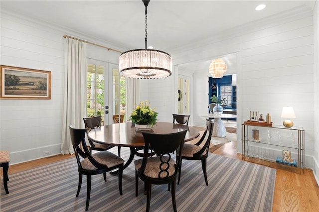 1141 Ragley Hall Rd NE, Brookhaven, GA 30319 - dining area featuring wood finished floors, french doors, crown molding, baseboards, and a chandelier
