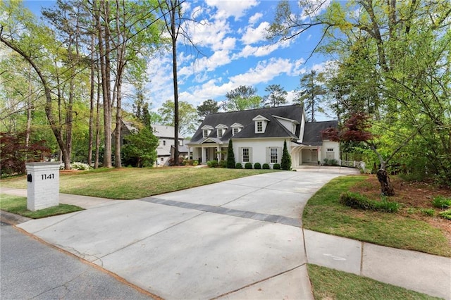 1141 Ragley Hall Rd NE, Brookhaven, GA 30319 - view of front of house with fence, stucco siding, concrete driveway, roof with shingles, and a front yard