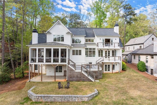 1141 Ragley Hall Rd NE, Brookhaven, GA 30319 - view of front of house with driveway, a front lawn, and stucco siding