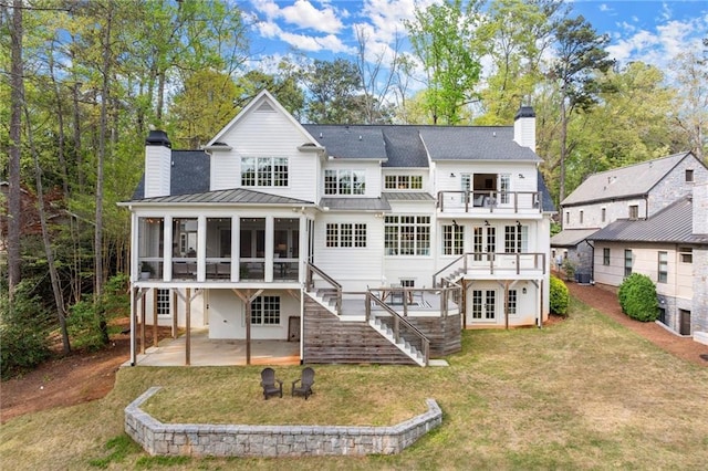 1141 Ragley Hall Rd NE, Brookhaven, GA 30319 - rear view of house with stairway, a chimney, a balcony, a patio area, and a sunroom