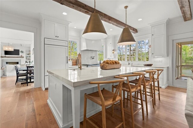 1141 Ragley Hall Rd NE, Brookhaven, GA 30319 - dining area with wood finished floors, a chandelier, crown molding, baseboards, and french doors