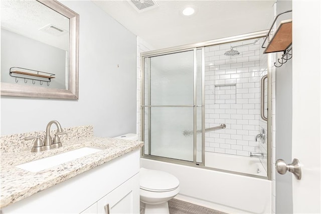 full bathroom with toilet, enclosed tub / shower combo, vanity, and visible vents