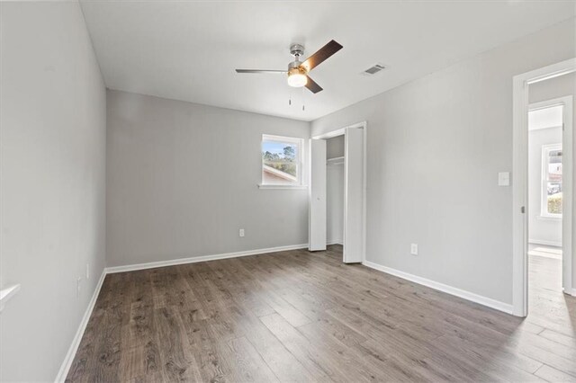 unfurnished bedroom featuring ceiling fan and hardwood / wood-style floors