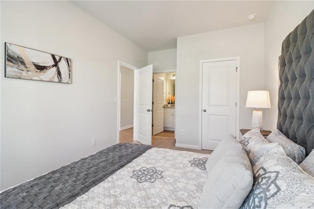 11113 Suria Dr, Covington, GA 30014 - bedroom featuring ensuite bath and baseboards