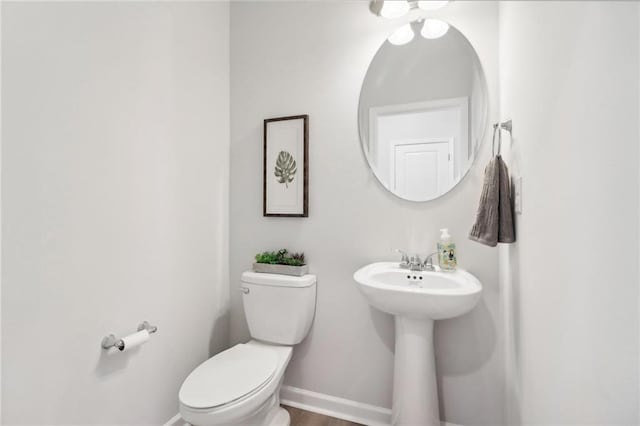 11113 Suria Dr, Covington, GA 30014 - bathroom featuring toilet and baseboards