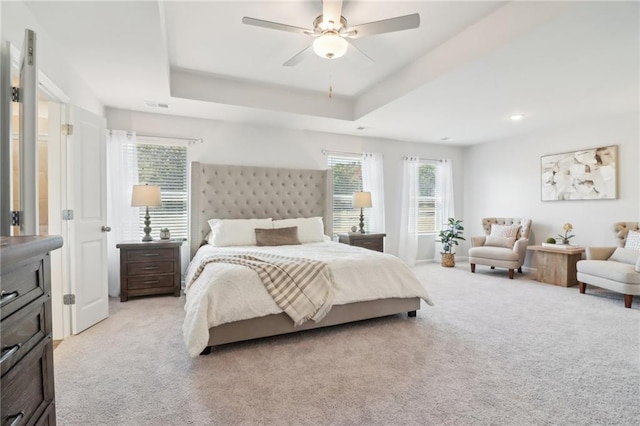 11113 Suria Dr, Covington, GA 30014 - bedroom with light carpet, multiple windows, a raised ceiling, and recessed lighting