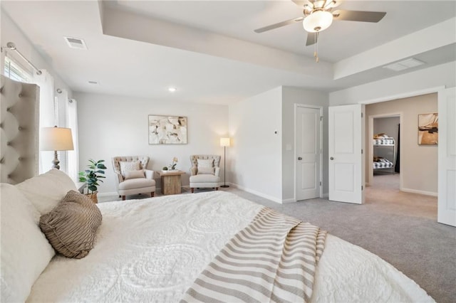 11113 Suria Dr, Covington, GA 30014 - carpeted bedroom featuring a tray ceiling and a ceiling fan