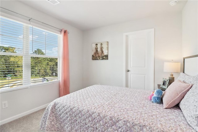 11113 Suria Dr, Covington, GA 30014 - bedroom with carpet floors and baseboards