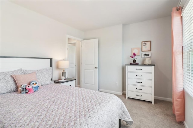 11113 Suria Dr, Covington, GA 30014 - bedroom with light carpet and multiple windows