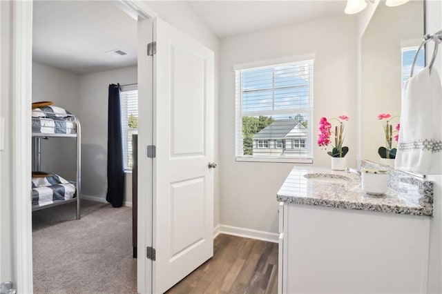 11113 Suria Dr, Covington, GA 30014 - bathroom featuring vanity and wood finished floors