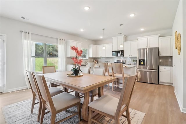 11113 Suria Dr, Covington, GA 30014 - dining room with light wood-style floors and recessed lighting