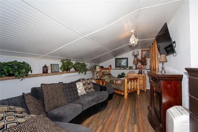 living room with vaulted ceiling and wood finished floors