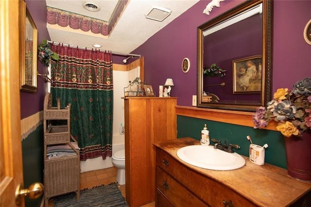full bathroom featuring shower / bath combo, vanity, toilet, tile patterned floors, and visible vents