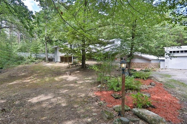 view of yard with a garage