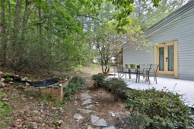 view of yard with a patio area and french doors