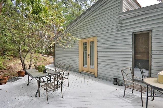 wooden terrace with outdoor dining area