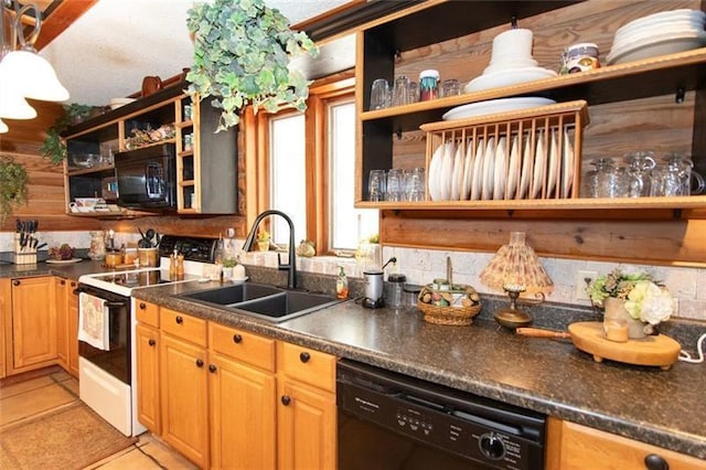 kitchen featuring open shelves, light tile patterned flooring, dark countertops, a sink, and black appliances