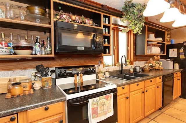 kitchen with a sink, open shelves, black appliances, and light tile patterned flooring