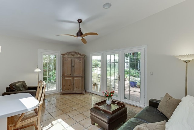 3219 Parkridge Cres, Chamblee, GA 30341 - living area with vaulted ceiling, light tile patterned flooring, and a ceiling fan