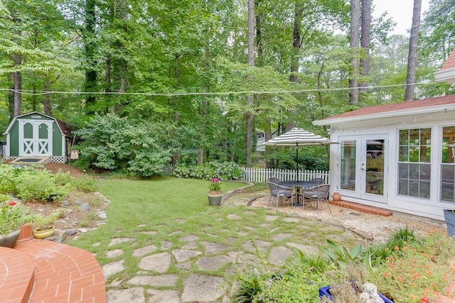 3219 Parkridge Cres, Chamblee, GA 30341 - view of yard with a shed, a patio, french doors, and view of wooded area