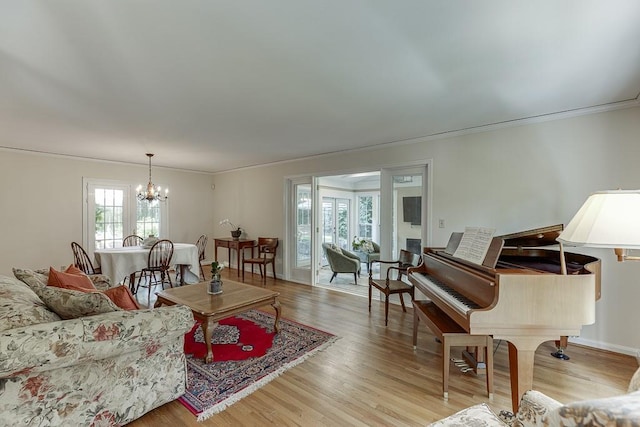 3219 Parkridge Cres, Chamblee, GA 30341 - living area with a chandelier, plenty of natural light, ornamental molding, and light wood finished floors