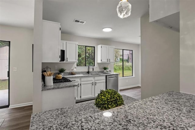 4912 Bayside Ct, Stone Mountain, GA 30088 - kitchen featuring dishwasher, dark wood-type flooring, and white cabinets