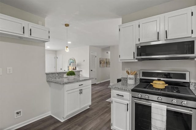 4912 Bayside Ct, Stone Mountain, GA 30088 - kitchen featuring appliances with stainless steel finishes, dark wood-type flooring, white cabinets, light stone countertops, and recessed lighting