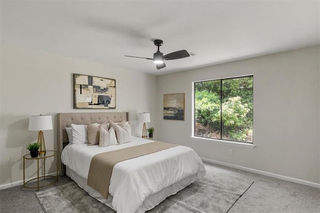 4912 Bayside Ct, Stone Mountain, GA 30088 - carpeted bedroom with baseboards and a ceiling fan