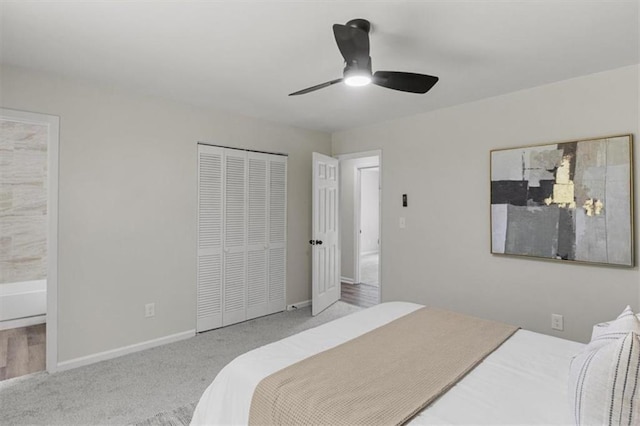 4912 Bayside Ct, Stone Mountain, GA 30088 - bedroom with carpet floors, connected bathroom, a closet, and ceiling fan