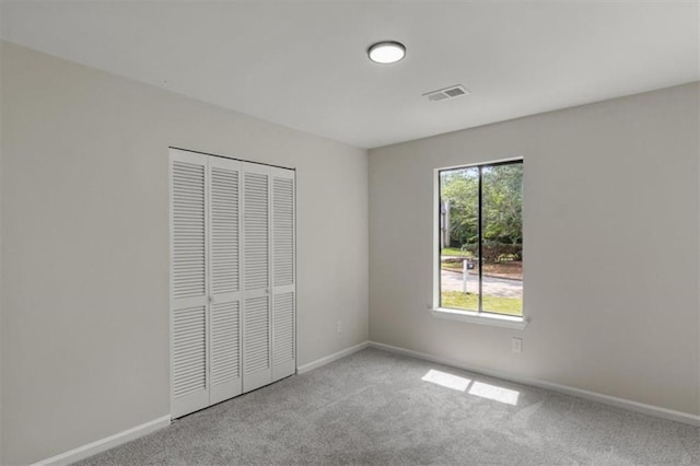4912 Bayside Ct, Stone Mountain, GA 30088 - unfurnished bedroom with carpet floors and a closet