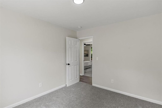 4912 Bayside Ct, Stone Mountain, GA 30088 - carpeted empty room featuring baseboards and a smoke detector