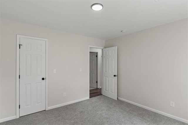 4912 Bayside Ct, Stone Mountain, GA 30088 - unfurnished bedroom featuring carpet floors and baseboards