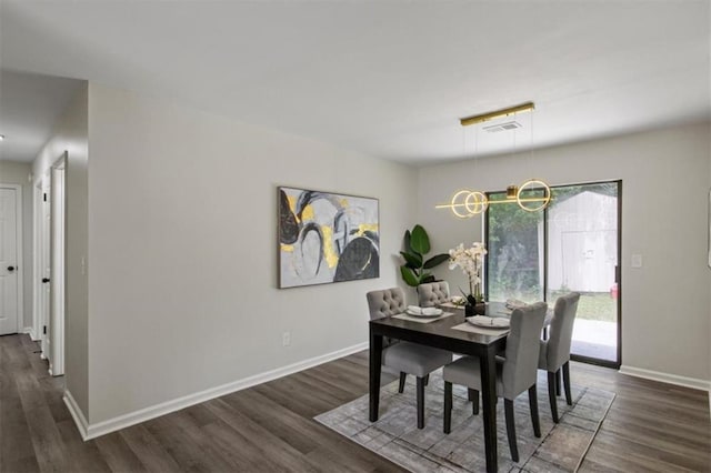 4912 Bayside Ct, Stone Mountain, GA 30088 - dining area featuring dark wood-style flooring