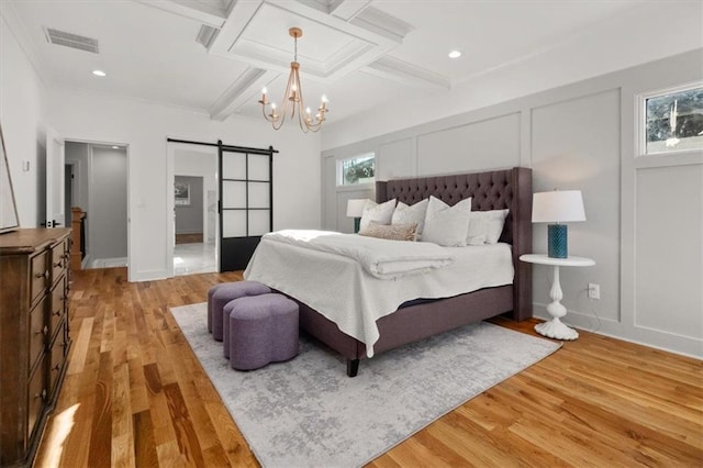 2018 Presley Way NE, Atlanta, GA 30317 - bedroom with a barn door, light wood finished floors, beamed ceiling, a chandelier, and coffered ceiling