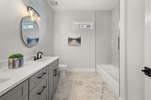 2018 Presley Way NE, Atlanta, GA 30317 - bathroom with toilet, double vanity, baseboards, and marble finish floors