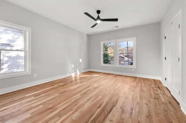 2018 Presley Way NE, Atlanta, GA 30317 - unfurnished bedroom with light wood-style floors, baseboards, a ceiling fan, and a closet