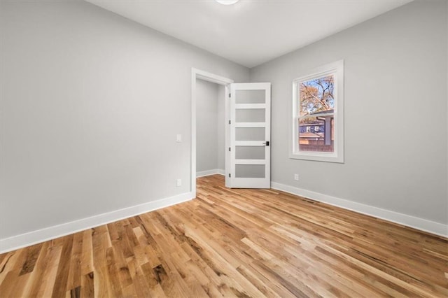 2018 Presley Way NE, Atlanta, GA 30317 - unfurnished bedroom with baseboards and light wood-style flooring