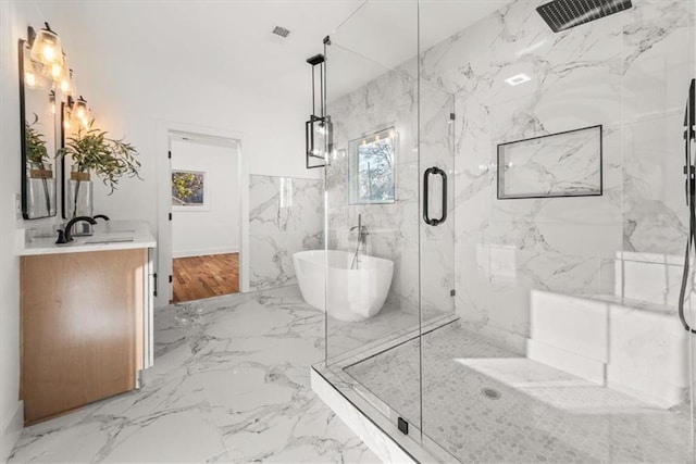 2018 Presley Way NE, Atlanta, GA 30317 - bathroom featuring healthy amount of natural light, a marble finish shower, a freestanding tub, and vanity