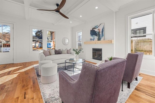2018 Presley Way NE, Atlanta, GA 30317 - living area with wood finished floors, a glass covered fireplace, a ceiling fan, beam ceiling, and coffered ceiling