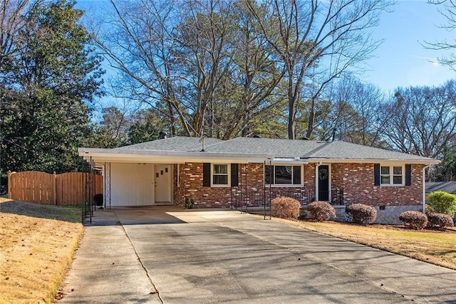 single story home featuring a carport