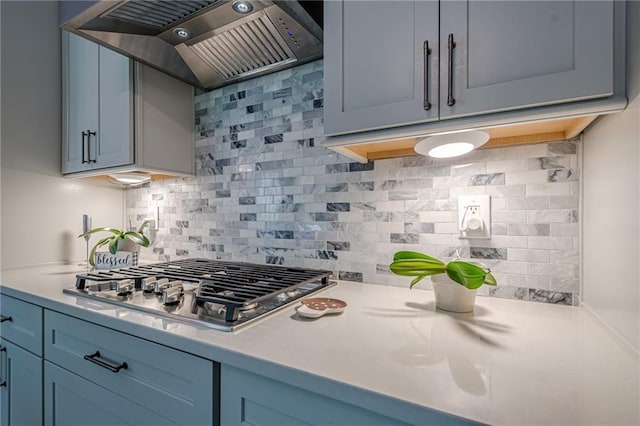 10865 Glenhurst Pass, Duluth, GA 30097 - kitchen featuring custom exhaust hood, stainless steel gas cooktop, light countertops, and backsplash