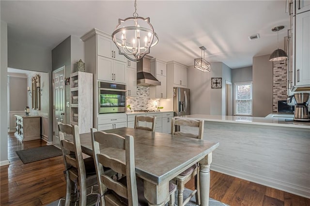 10865 Glenhurst Pass, Duluth, GA 30097 - dining space featuring a chandelier and dark wood-type flooring