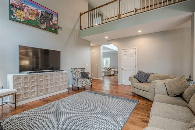 10865 Glenhurst Pass, Duluth, GA 30097 - living room featuring wood finished floors and a high ceiling