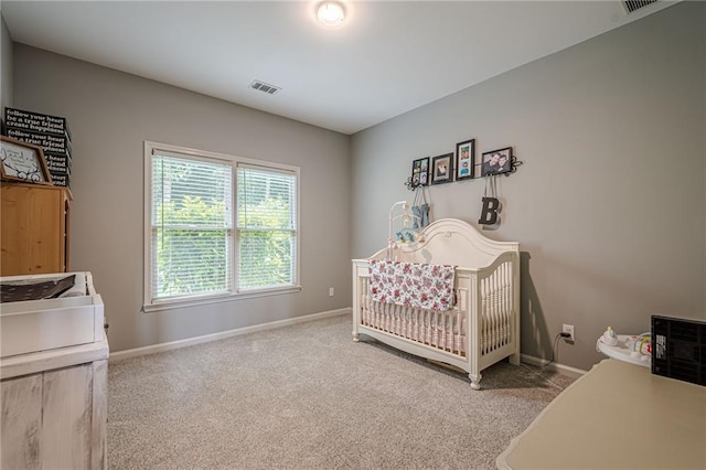 10865 Glenhurst Pass, Duluth, GA 30097 - carpeted bedroom with baseboards and a crib