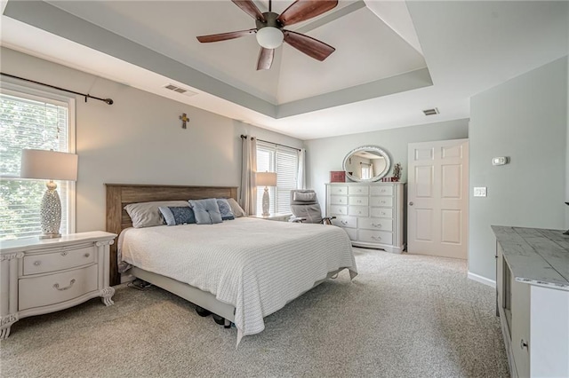 10865 Glenhurst Pass, Duluth, GA 30097 - bedroom featuring a raised ceiling, light colored carpet, and a ceiling fan