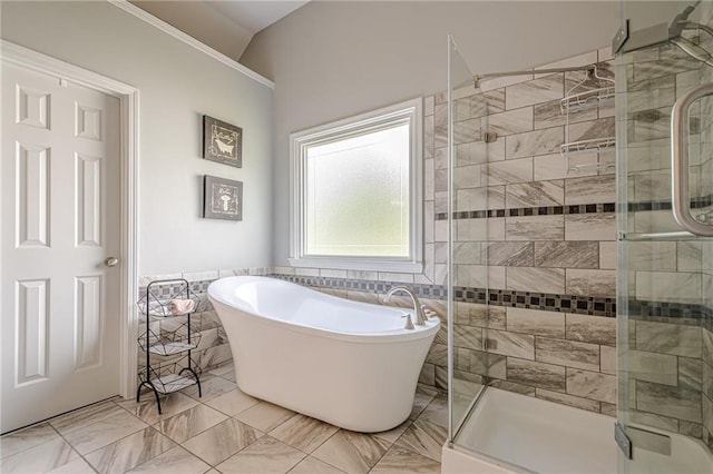 10865 Glenhurst Pass, Duluth, GA 30097 - bathroom featuring a shower stall, a freestanding tub, tile walls, and a wainscoted wall