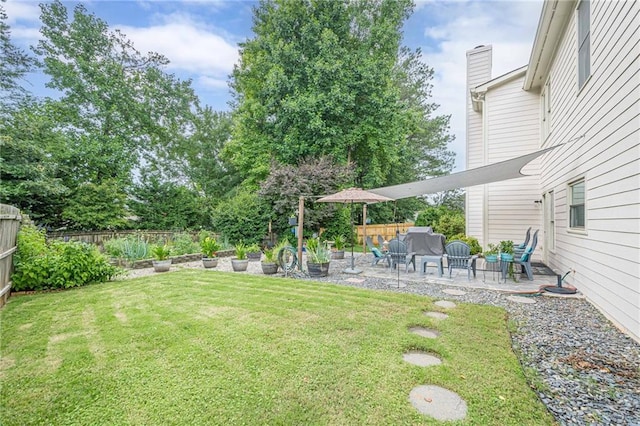 10865 Glenhurst Pass, Duluth, GA 30097 - fenced backyard with a patio area and a vegetable garden