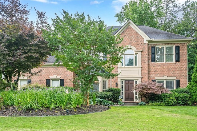 10865 Glenhurst Pass, Duluth, GA 30097 - view of front facade featuring brick siding and a front yard