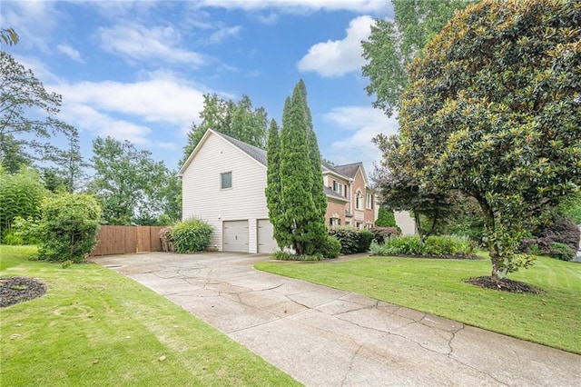 10865 Glenhurst Pass, Duluth, GA 30097 - view of home's exterior featuring a garage and concrete driveway